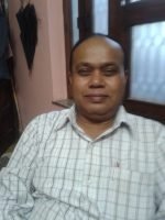 Senior Pathologist Dr. Raj Kumar Singh conducting diagnosis at Garhwal Pathology Lab since 1993